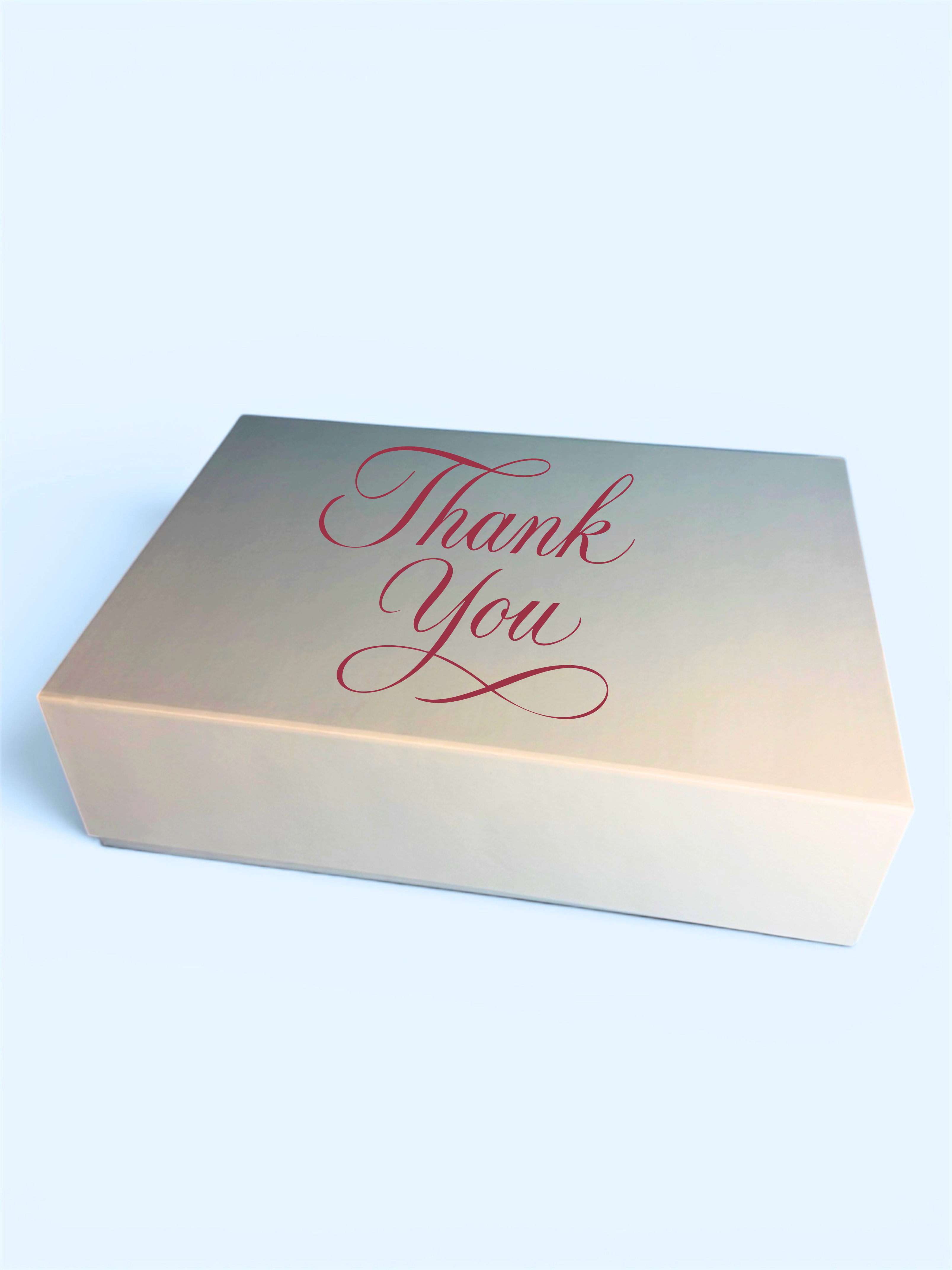 White gift  box with 'Thank You' text in red on a light blue background
