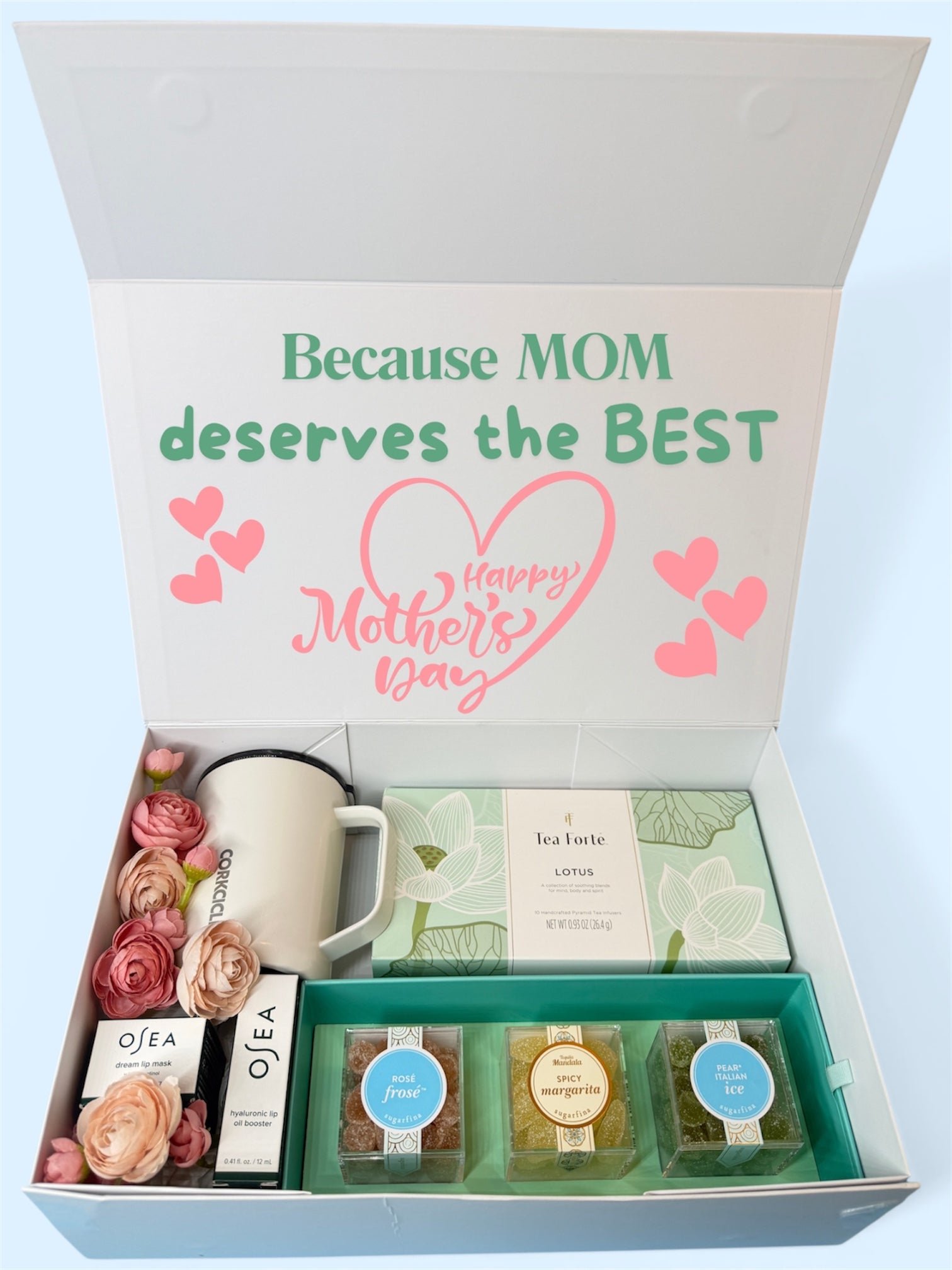 Gift set for Mom Grandna with Sugarfina Candy, Tea Forte Tea, Osea lip care, and Corkcircle stainless steel mug,  decorated with flowers and personalized with a note on the lid.  