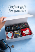 Gift set for gamers with items like a handmade crochet controller, a Roblox collectible toy, a candy cube, stainless steel water bottle.
