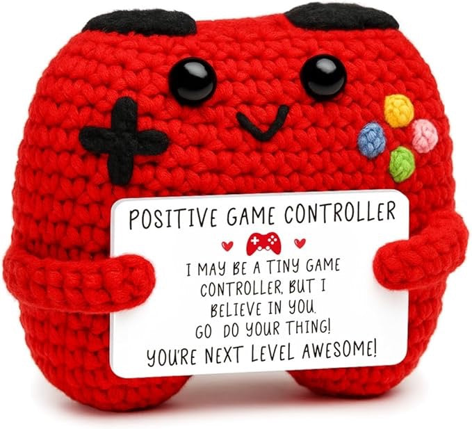 Red crochet  game controller with a message card on a white background