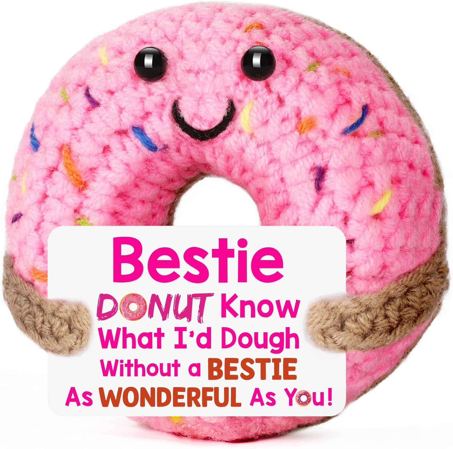 Pink donut-shaped plush toy with a smiling face holding a card.