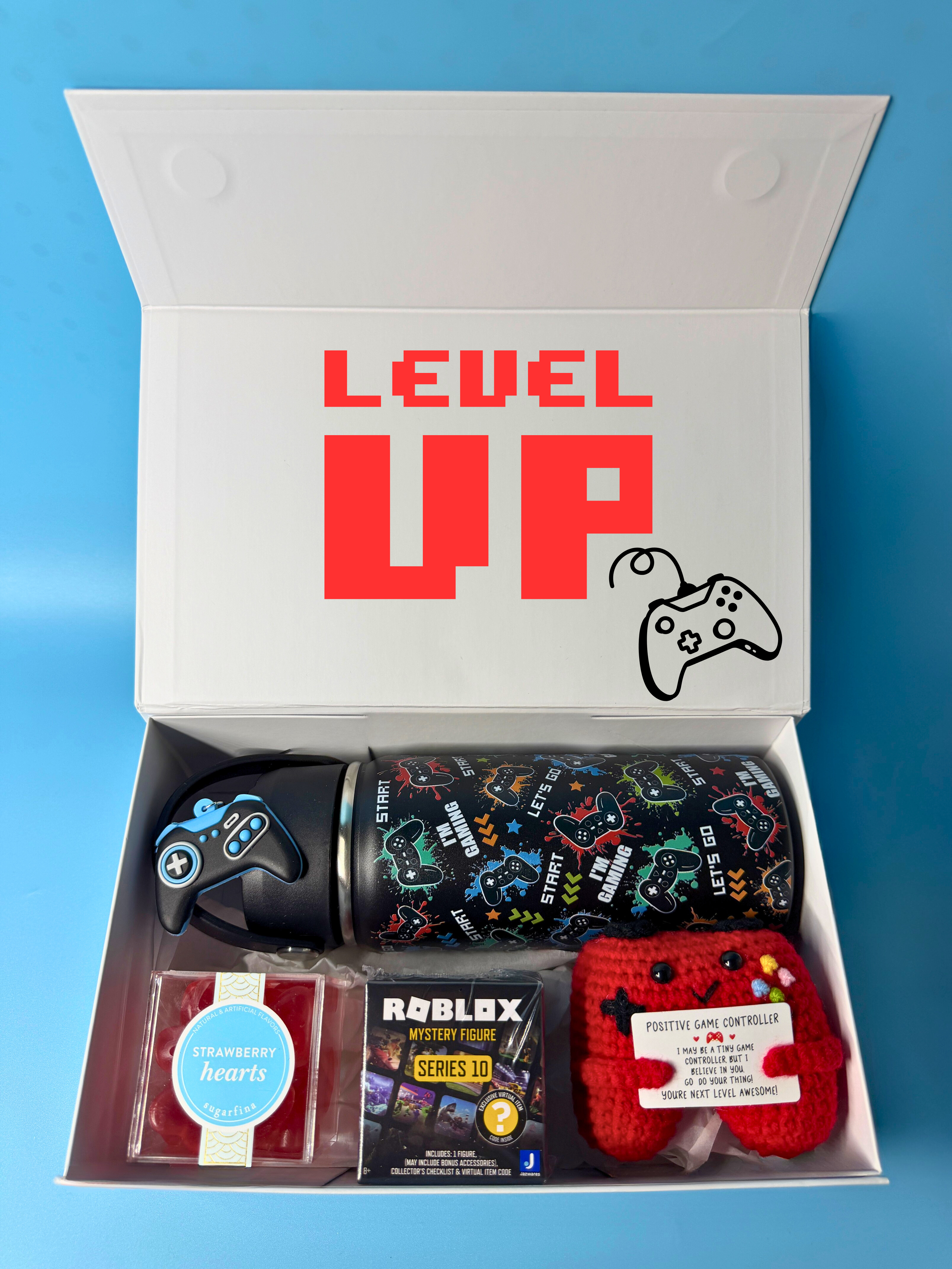 Gift box with 'Level Up' text and video gaming-themed items on a blue background