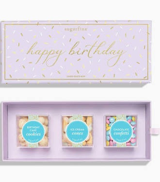 Set of three candy cubes  with 'happy birthday' text on a light purple box